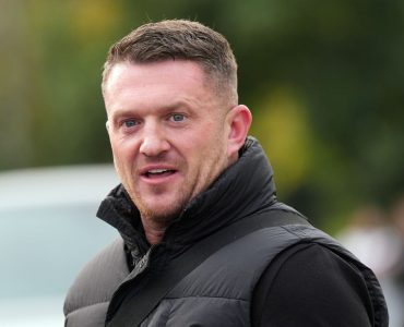 Tommy Robinson charged with terror offence after failing to provide phone password